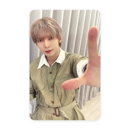 ATEEZ Yeosang GOLDEN HOUR Part.5 pop-up reward photocard — ash-beige hair, olive-green utility jumpsuit with white collar and belt, reaching one hand toward the camera, gray curtain and window light.
