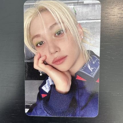 Stray Kids Felix 2026 Season Greetings Straight Supper Club Apple Music POB Photocard — platinum blonde green eyeshadow pearl earring dark varsity jacket patch embroidery