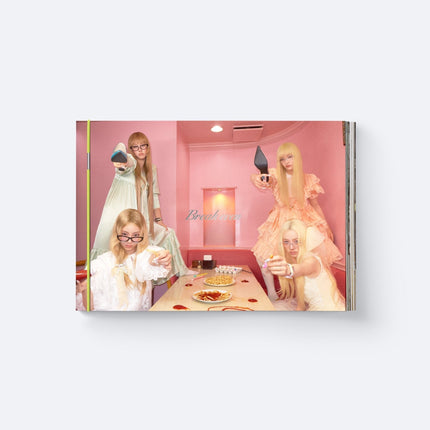 ILLIT BREAK EVEN Standard Ver. SIGNED MAD Ver. photobook cover: four blonde members in glasses and pastel dresses aiming high heels in a pink diner with fries and ketchup, lime green book band