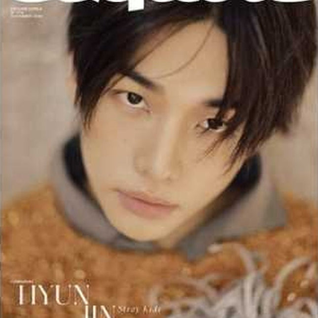 Stray Kids Hyunjin ESQUIRE Korea November 2026 magazine Cover A – close-up of Hyunjin with tousled black hair in a rust-orange shaggy fringed knit over a grey hoodie, white ESQUIRE logo