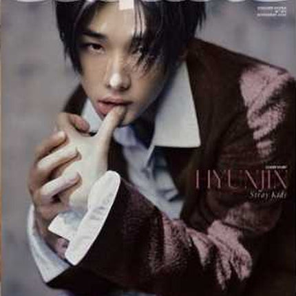 Stray Kids Hyunjin ESQUIRE Korea November 2026 magazine Cover B – Hyunjin in a burgundy textured jacket and white collar holding a white sculptural hand prop to his lips, sequined trousers, silver ESQUIRE logo