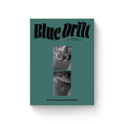 TEEZ 8th Anniversary Photobook Blue Drift front cover – deep teal-green hardcover-style book with the title "Blue Drift" in a warped, wavy black display font across the top, two stacked black-and-white photo windows in the center, and "ATEEZ 8TH ANNIVERSARY PHOTOBOOK" printed in small caps along the bottom edge