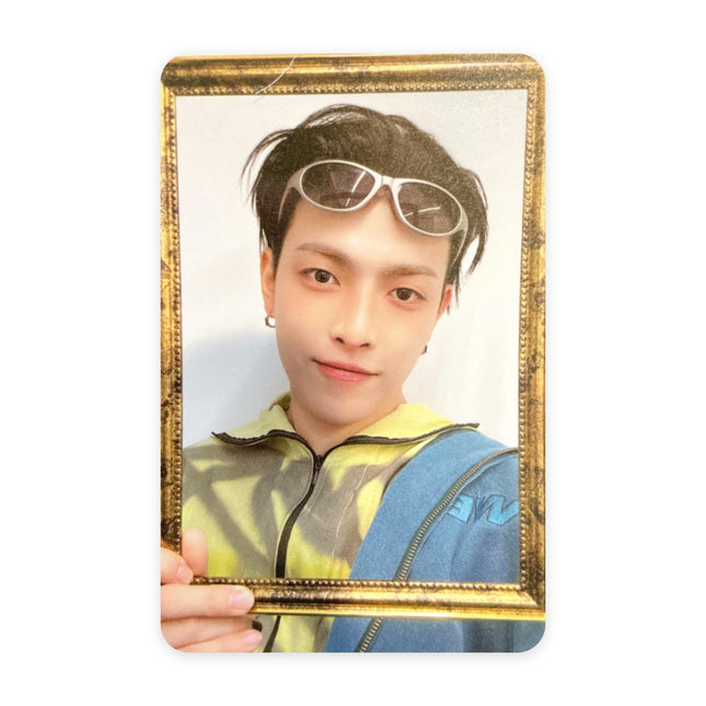 ATEEZ Hongjoong ANITEEZ IN COLOR Type A POB photocard — black hair with white wraparound sunglasses pushed up on his head, yellow and lime tie-dye top under a blue jacket, framing his face with an antique gold picture frame