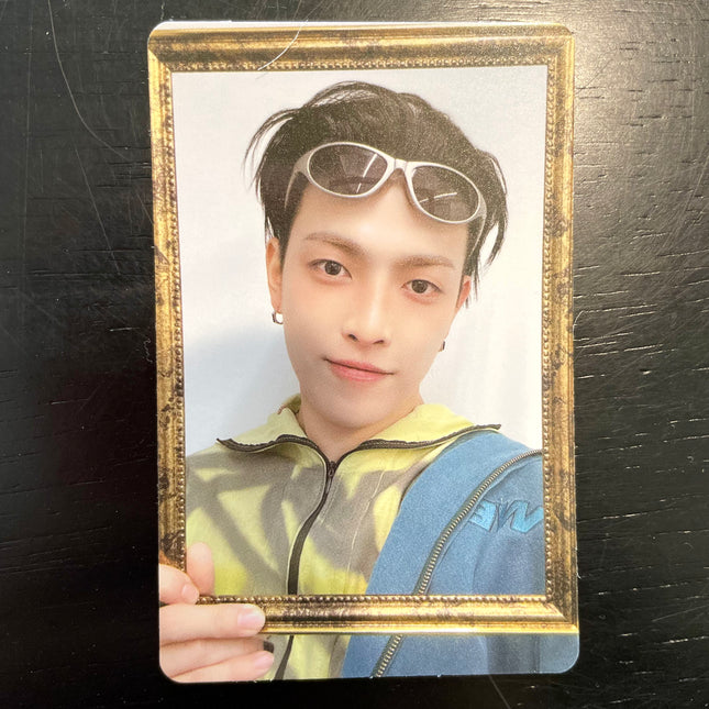 ATEEZ Hongjoong ANITEEZ IN COLOR Type A POB photocard — black hair with white wraparound sunglasses pushed up on his head, yellow and lime tie-dye top under a blue jacket, framing his face with an antique gold picture frame