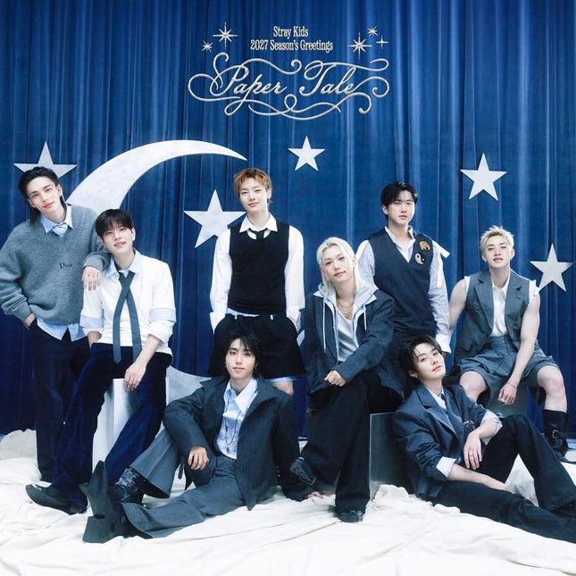 Stray Kids 2027 Season's Greetings Paper Tale group teaser image, eight members styled as fairy-tale storybook characters surrounded by paper-cut and origami-style decorations